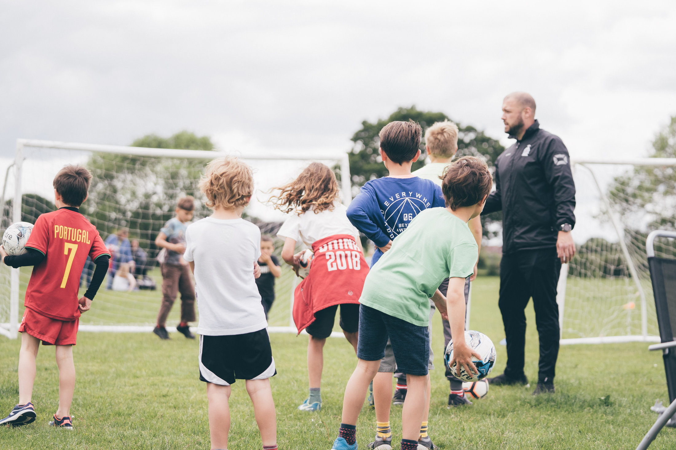 A Soccer Stars coach running a session